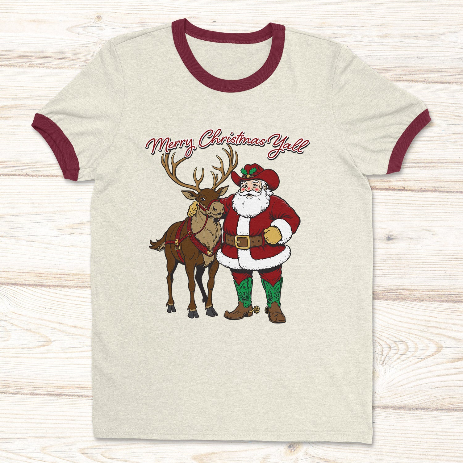 Natural and Maroon Ringer T-shirt with a western Santa Claus and Reindeer.